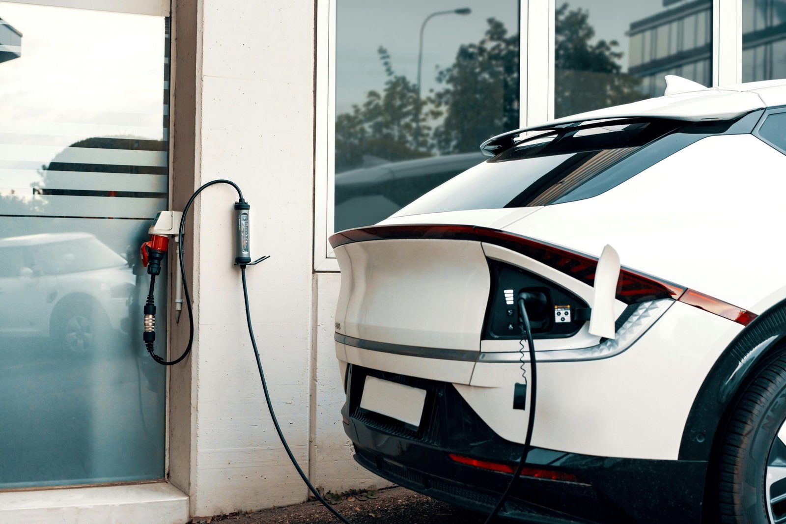 An electric car plugged into a charging station